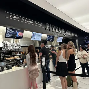 customers waiting in line at the counter