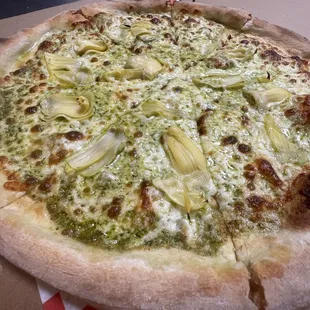 a pizza with cheese and artichokes