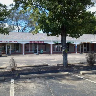 the front of the restaurant and parking lot