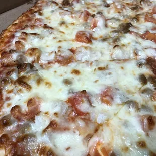 XL Thin Crust Pizza with Italian Sausage, Tomatoes, Onions, and Extra Cheese!!!