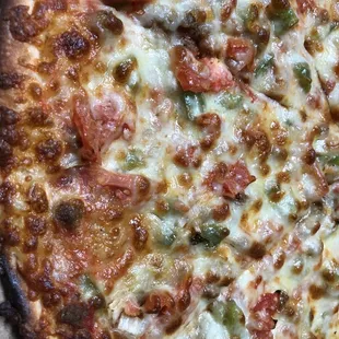 Thin Crust XL Pizza with Italian Sausage, Tomatoes, Onions, and Peppers (close up!)