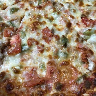 Thin Crust XL Pizza with Italian Sausage, Tomatoes, Onions, and Peppers (close up!)