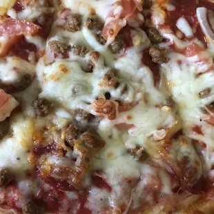 Slice of XL Pizza with Pepperoni, Italian Sausage, Sliced Tomatoes, and Onions!!!