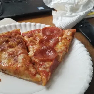 Slice of cheese and slice of pepperoni