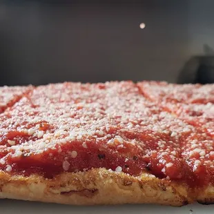 Sicilian Pizza &quot; Our Legendary Favorite&quot;  Family recipe of homemade tomato sauce sprinkled with Pecorino Romano Cheese.