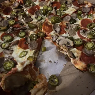 Mushroom, jalapeño, pepperoni and sausage pizza.