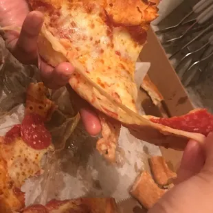 Pizza just peeling off the bread because it's so thick