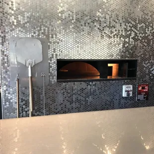 a pizza oven in the background