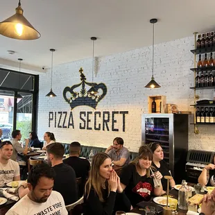 a group of people eating at a restaurant