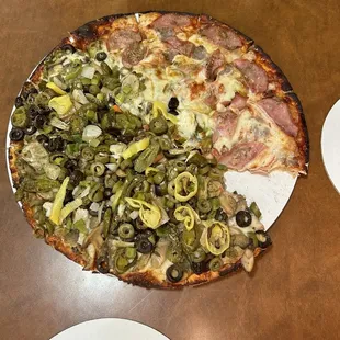 14&quot; Iowa stone style pizza halved with sausage and Canadian bacon and customized veggie.