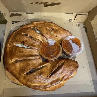 Mushroom calzone- huge! Those are 4 oz sauce containers!