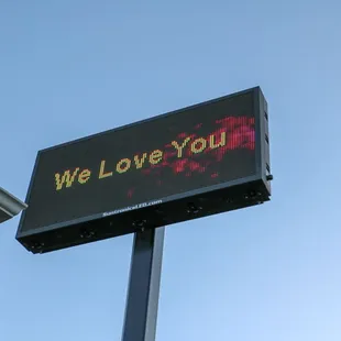 we love you message on a sign