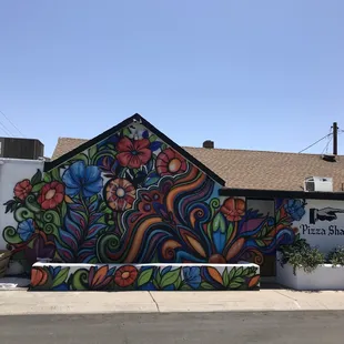 a colorful mural on the side of a building