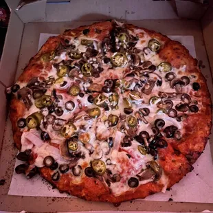 Large jalapeño, olive, onion &amp; mushroom pizza.