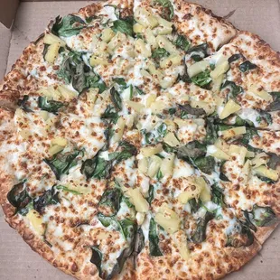Alfredo sauce, mozzarella cheese, spinach, and pineapples