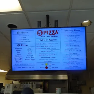 Digital menu board above the counter.