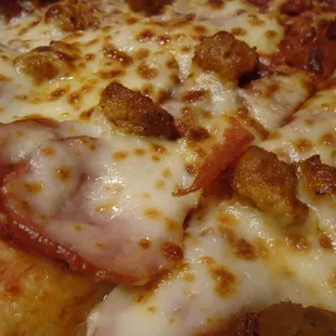Meat lover&apos;s pizza, close-up.