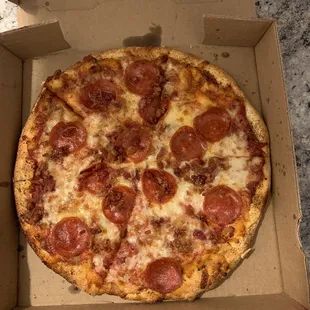 a pepperoni pizza in a box