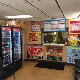 the inside of a pizza place