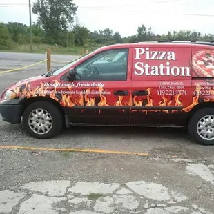 a red van with flames on it