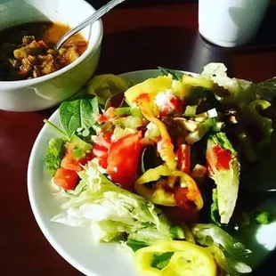 a plate of salad and a bowl of soup