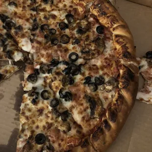 a half eaten pizza in a box
