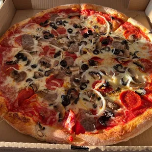 a pizza in a cardboard box