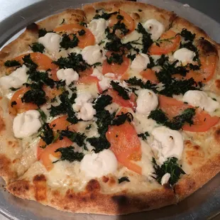 a close up of a pizza on a pan