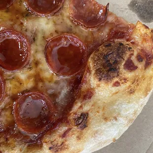 Pepperoni pizza with a hot honey drizzle.