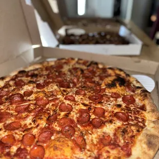 a pepperoni pizza in a box