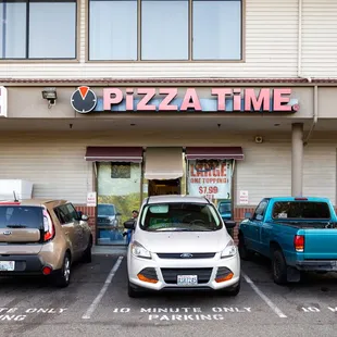 three cars parked in a parking lot