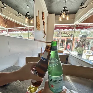 Cheers to great pizza!