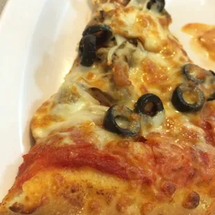 a slice of pizza on a plate