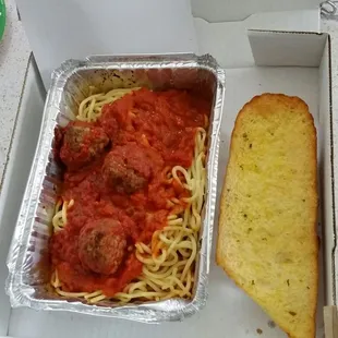 Spaghetti with meatballs &amp; garlic bread.