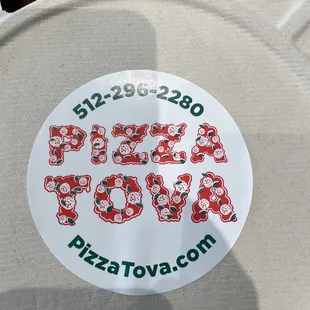 a sticker on a pizza box