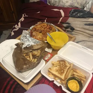 a tray of food on a bed