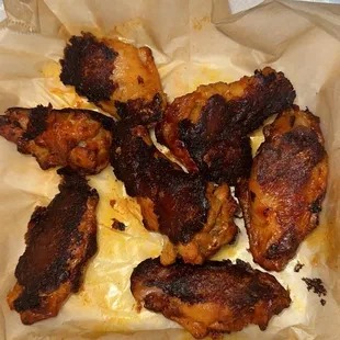 chicken wings in a paper container