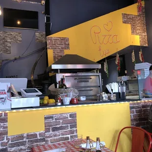 a restaurant counter with a checkered table cloth