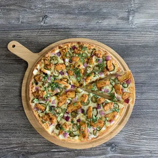 a pizza on a cutting board