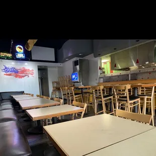 empty tables and chairs in a restaurant