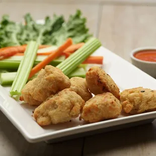  plate of appetizers with carrots and celery