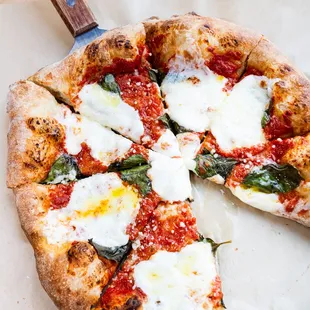 Margherita pie, topped with fresh basil