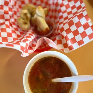 a bowl of soup with a spoon in it