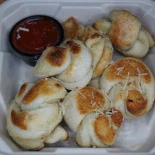 bread rolls in a styrofoam container