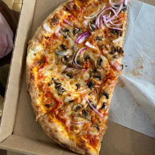 a slice of pizza in a box