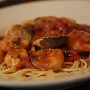 a plate of pasta with shrimp