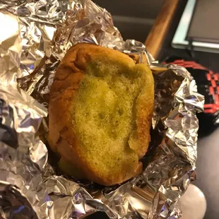 a piece of bread wrapped in tin foil