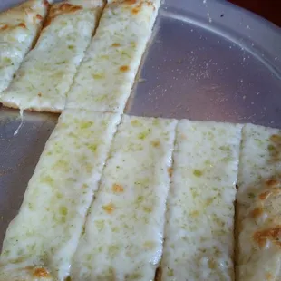 I think this was called breadsticks with cheese. I'd call it an Italian Quesadilla. Mmmm good.