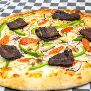 a pizza with meat and vegetables