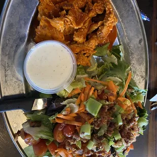 Grilled buffalo chicken salad. Huge, spicy and delicious.